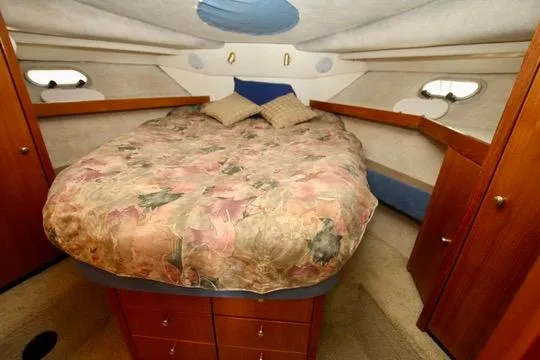 Slide: The Image of Cozy bedroom in 1996 Bayliner 3788 Command Bridge Motoryacht with floral bedding and wood accents. - 35
