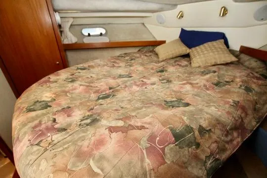 Slide: The Image of Cozy bedroom in 1996 Bayliner 3788 Command Bridge Motoryacht with patterned bedding and pillows. - 37