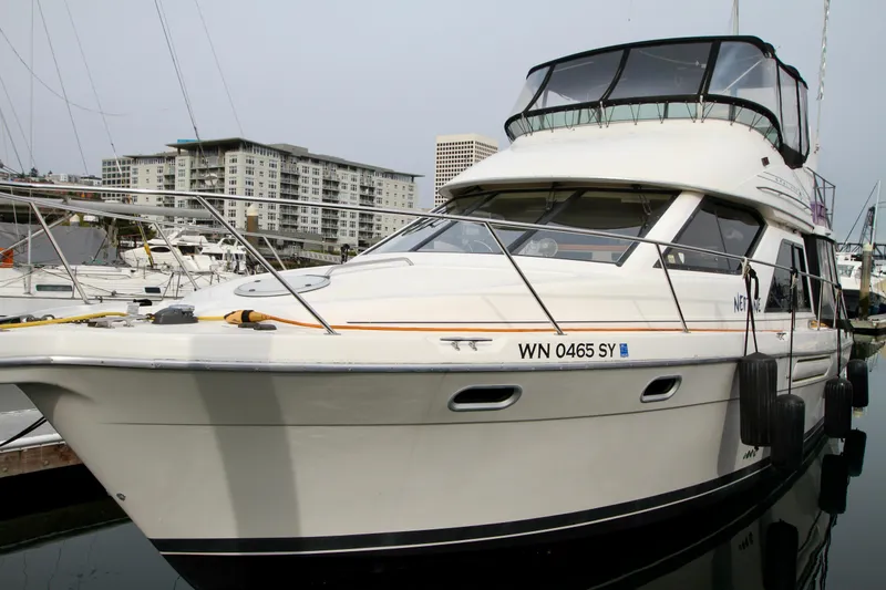 Slide: The Image of 1996 Bayliner 3788 Command Bridge Motoryacht docked in marina. - 5