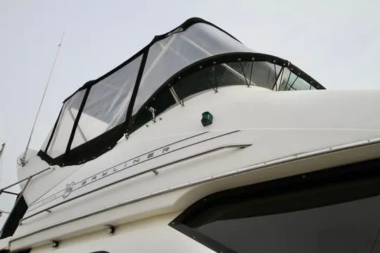 Slide: The Image of 1996 Bayliner 3788 Command Bridge Motoryacht, close-up of upper deck and windows. - 6