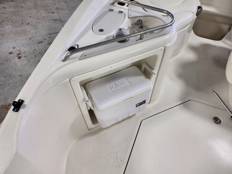 Slide: The Image of 2007 Monterey 250 Cruiser interior with built-in cooler storage. - 12