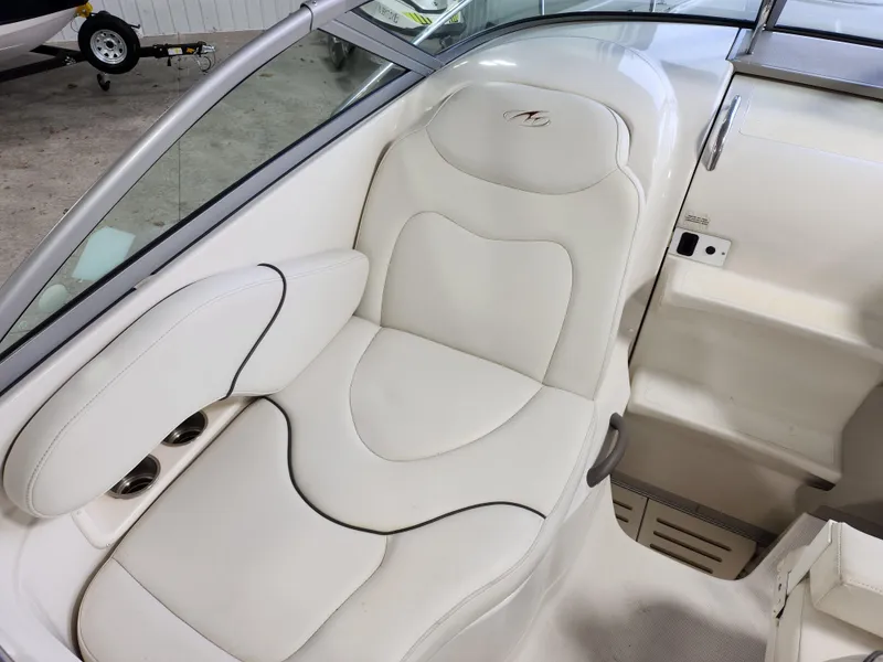Slide: The Image of 2007 Monterey 250 Cruiser interior with white leather seating and sleek design. - 14