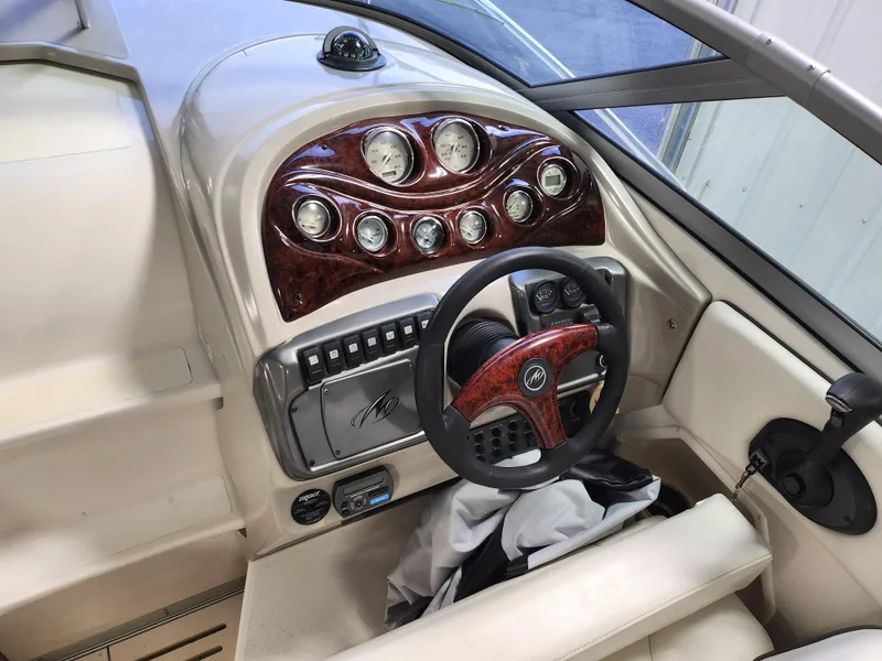 Slide: The Image of 2007 Monterey 250 Cruiser dashboard with wood accents and steering wheel. - 15