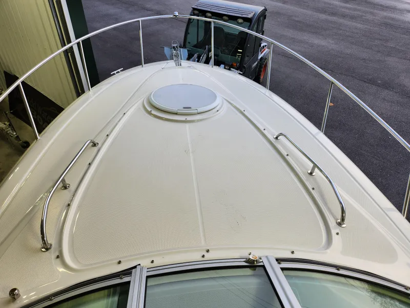 Slide: The Image of 2007 Monterey 250 Cruiser boat deck with railing and hatch, viewed from above. - 17