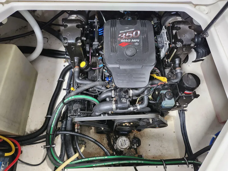 Slide: The Image of Engine compartment of a 2007 Monterey 250 Cruiser boat, featuring a MerCruiser 350 MAG MPI. - 19