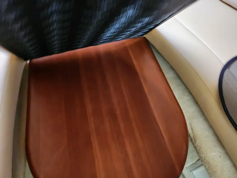 Slide: The Image of Interior view of 2007 Monterey 250 Cruiser with wooden table and cushioned seating. - 28