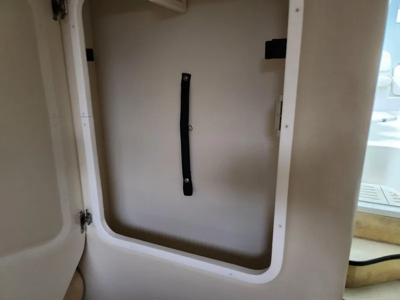 Slide: The Image of 2007 Monterey 250 Cruiser interior compartment with open door and strap. - 30