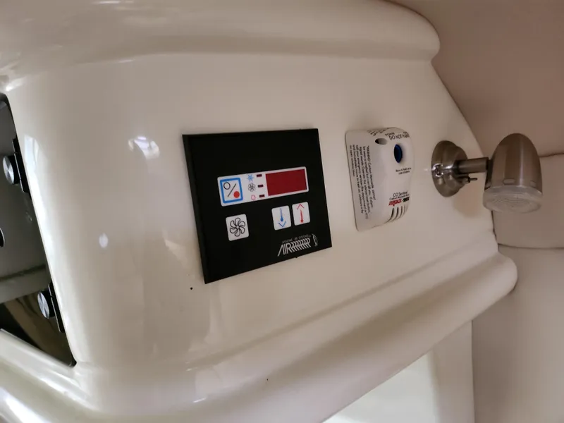 Slide: The Image of Control panel on a 2007 Monterey 250 Cruiser boat interior. - 32