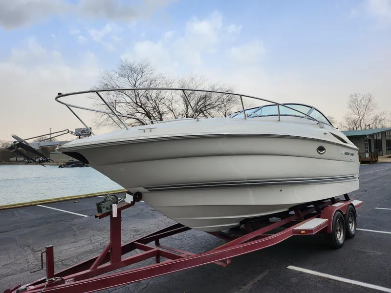 Slide: The Image of 2007 Monterey 250 Cruiser boat on trailer by waterfront. - 8