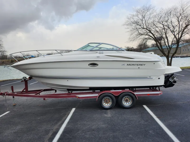 Slide: The Image of 2007 Monterey 250 Cruiser boat on trailer in parking lot. - 9