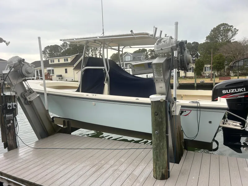 Slide: The Image of Parker 23 Special Edition boat, 2012 model, docked with Suzuki outboard motor. - 1