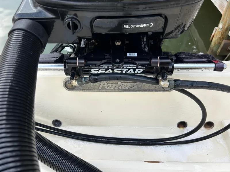 Slide: The Image of Steering mechanism of a 2012 Parker 23 Special Edition boat with SeaStar hydraulic system. - 13