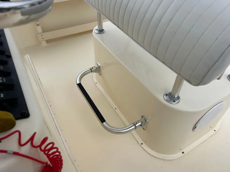 Slide: The Image of Interior of a 2012 Parker 23 Special Edition boat, featuring a bench seat and footrest. - 18