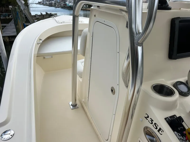 Slide: The Image of 2012 Parker 23 Special Edition boat interior with console and seating. - 19