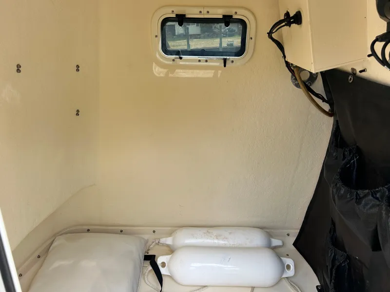Slide: The Image of Interior cabin of 2012 Parker 23 Special Edition boat with window and storage. - 20