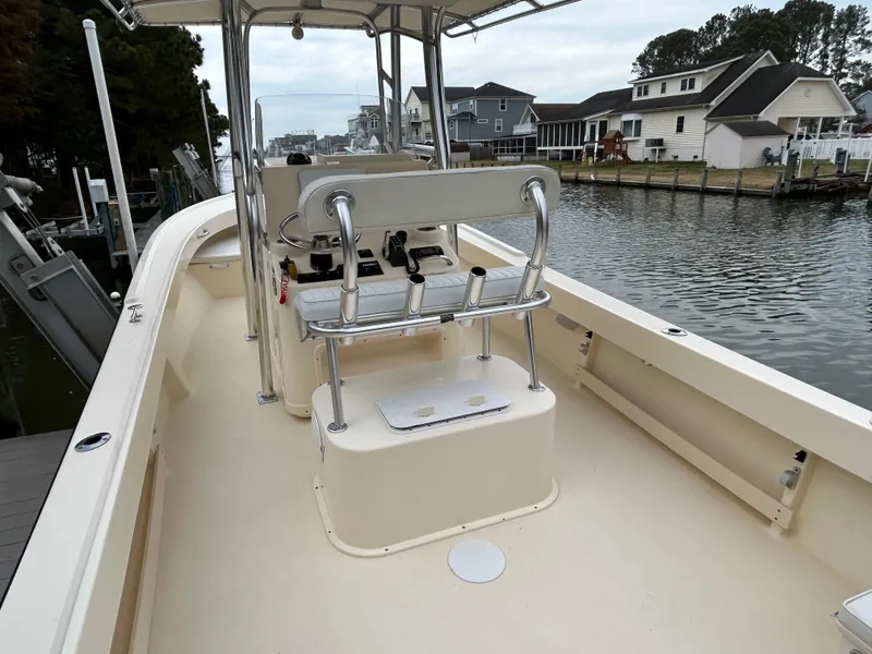 Slide: The Image of 2012 Parker 23 Special Edition boat docked by waterfront homes. - 4