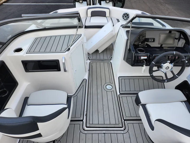 Slide: The Image of 2017 Yamaha Boats AR190 interior with sleek seating and modern dashboard design. - 11