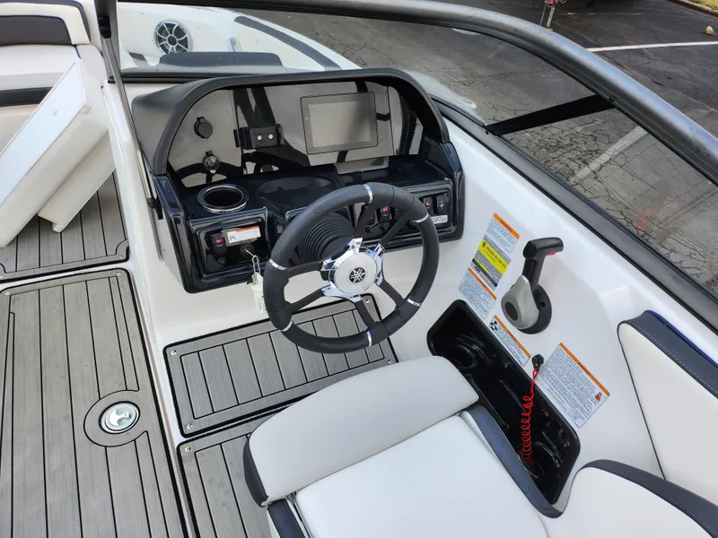 Slide: The Image of 2017 Yamaha Boats AR190 cockpit with steering wheel and control panel. - 12