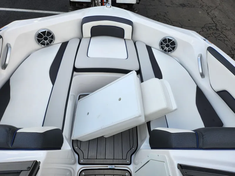 Slide: The Image of 2017 Yamaha Boats AR190 interior with white and gray seating, featuring built-in speakers. - 17