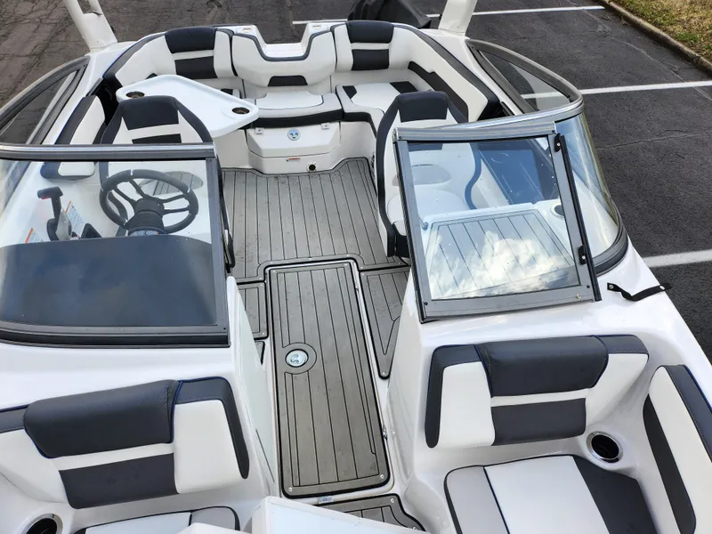 Slide: The Image of 2017 Yamaha Boats AR190 interior with sleek seating and modern dashboard design. - 19