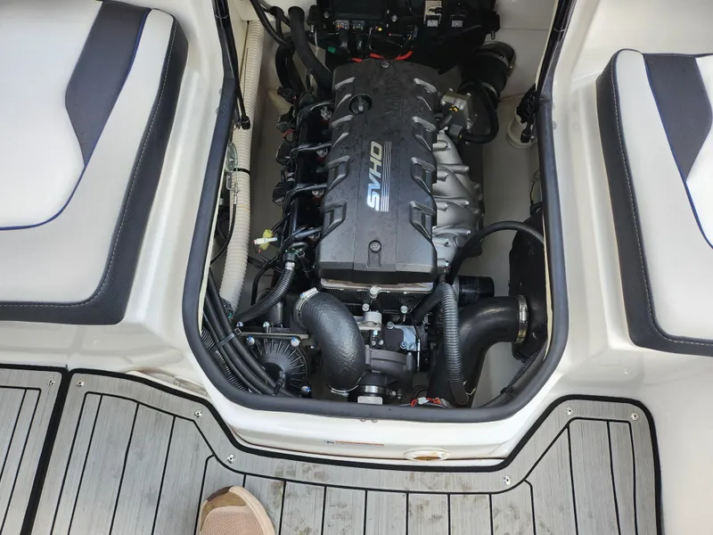 Slide: The Image of 2017 Yamaha Boats AR190 engine compartment with visible components and seating area. - 22