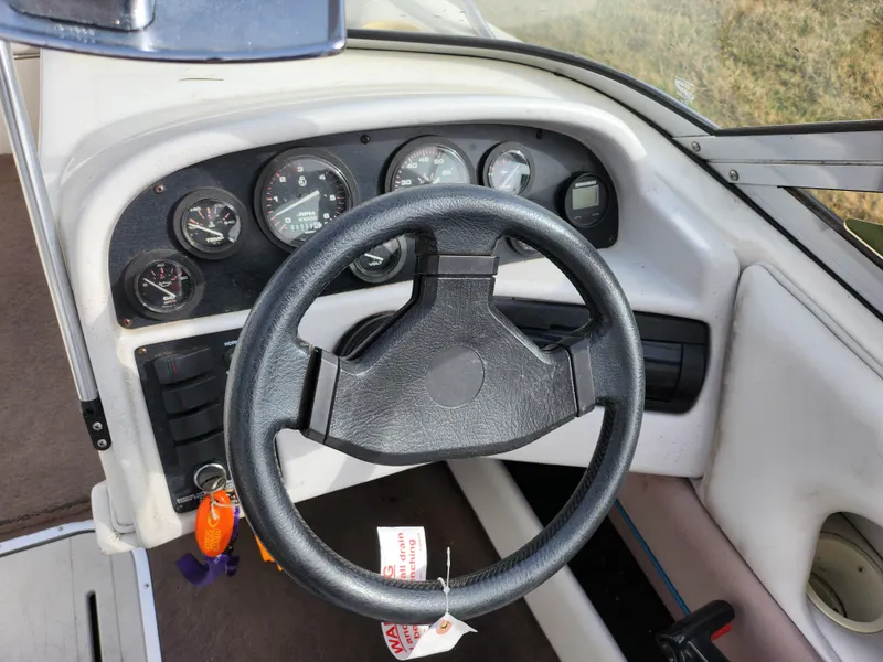 Slide: The Image of Steering wheel and dashboard of a 1994 Caravelle 1900 SE boat. - 13