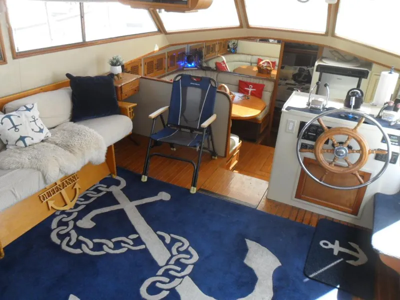 Slide: The Image of Interior of 1986 Symbol Yachtfisher with nautical decor and wooden steering wheel. - 12