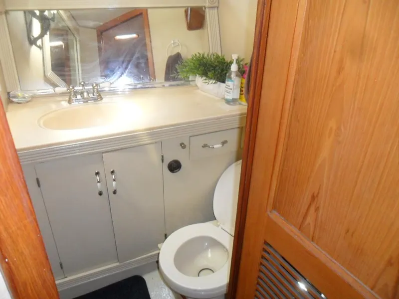 Slide: The Image of 1986 Symbol Yachtfisher bathroom with sink, mirror, and toilet. - 20