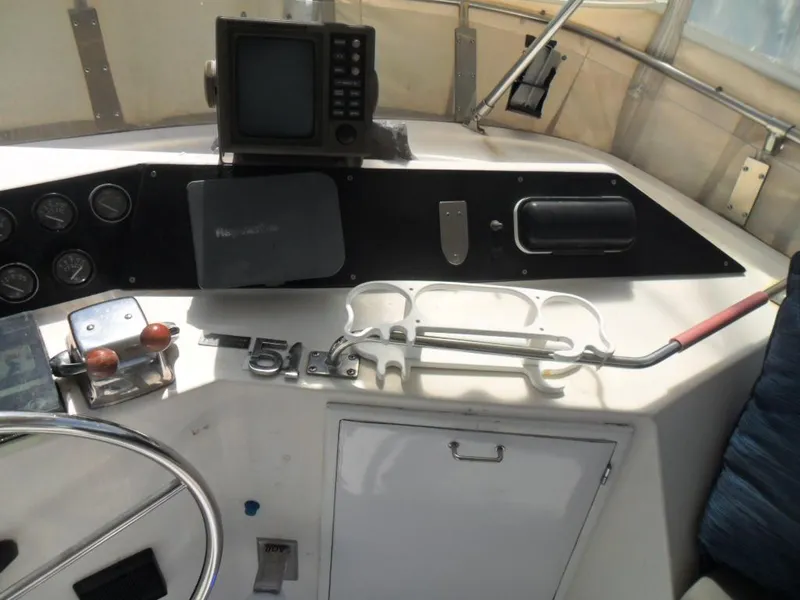 Slide: The Image of 1986 Symbol Yachtfisher helm with navigation equipment and controls. - 30