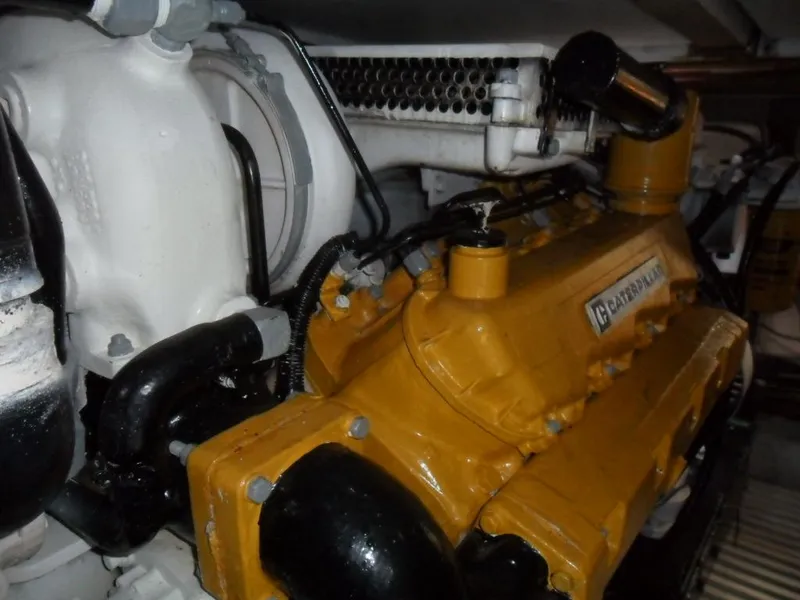 Slide: The Image of Engine room of 1986 Symbol Yachtfisher with Caterpillar engine components. - 39