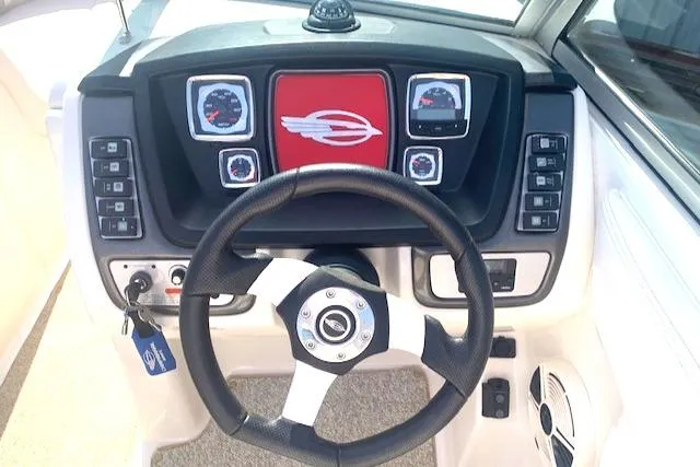 Slide: The Image of 2010 Chaparral Sunesta 224 dashboard with steering wheel and control panel. - 6