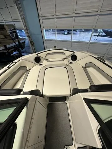Slide: The Image of 2018 Yamaha Boats AR195 interior, showcasing spacious seating and sleek design. - 10