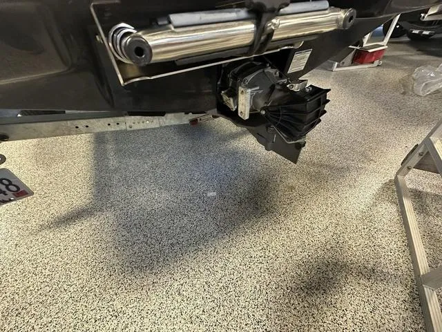 Slide: The Image of 2018 Yamaha Boats AR195 jet drive system on a speckled garage floor. - 5