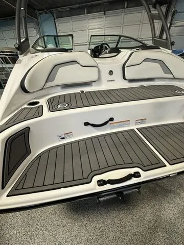 Slide: The Image of 2018 Yamaha Boats AR195, rear deck view, featuring sleek design and comfortable seating. - 6