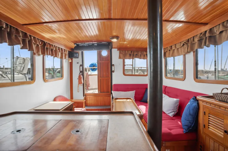 Slide: The Image of Interior of 1987 Lord Nelson 37 Victory Tug with wooden finish and red seating. - 14