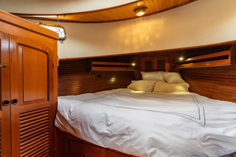Slide: The Image of Cozy cabin interior of 1987 Lord Nelson 37 Victory Tug with wooden finish and comfortable bedding. - 19