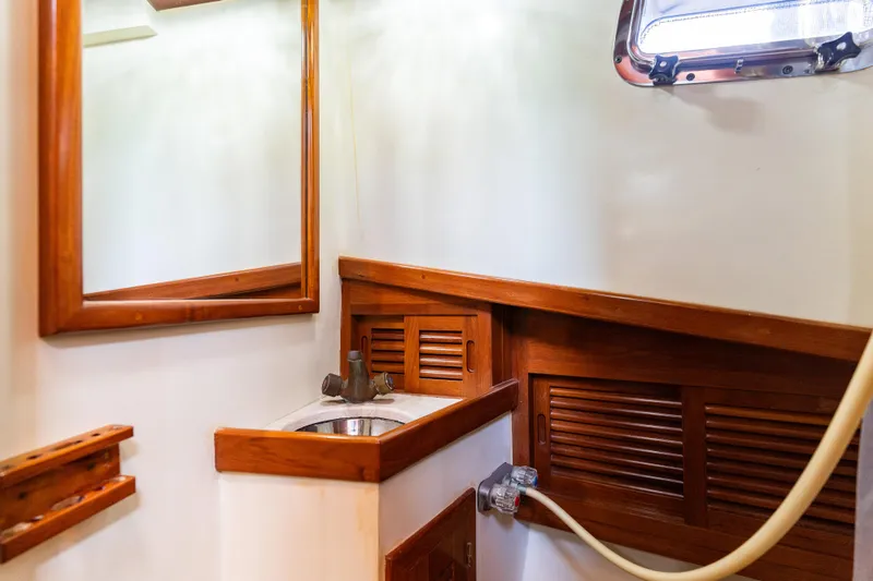 Slide: The Image of 1987 Lord Nelson 37 Victory Tug bathroom with wooden accents and a small sink. - 22