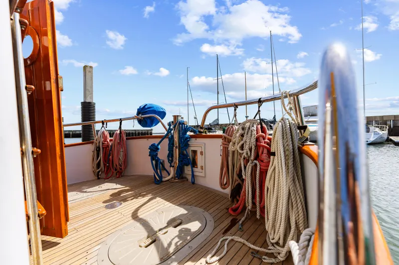 Slide: The Image of Deck of 1987 Lord Nelson 37 Victory Tug with ropes and clear sky. - 23