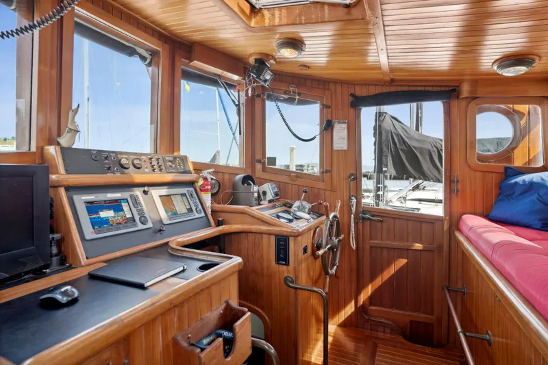 Slide: The Image of Interior of 1987 Lord Nelson 37 Victory Tug with wooden paneling and navigation equipment. - 5