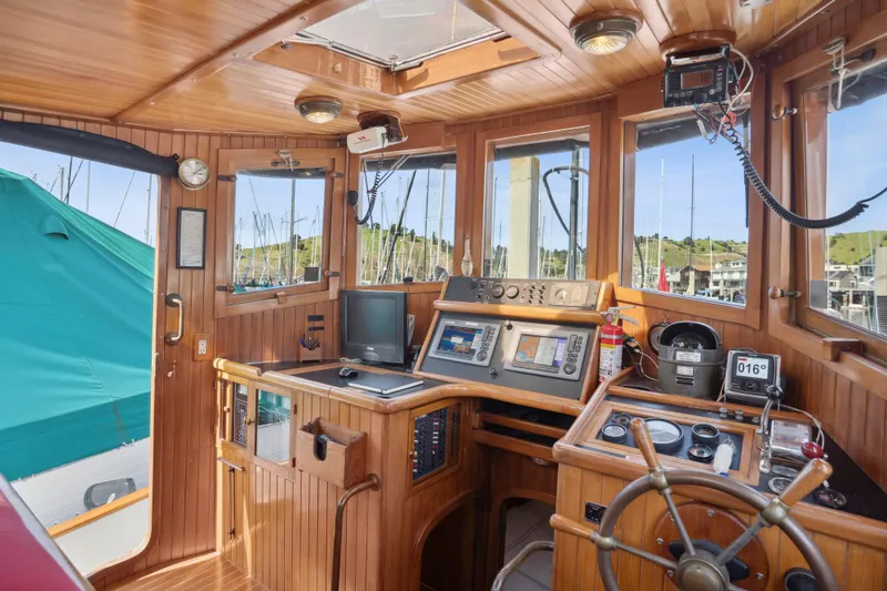 Slide: The Image of Interior of 1987 Lord Nelson 37 Victory Tug with wooden helm and navigation equipment. - 6
