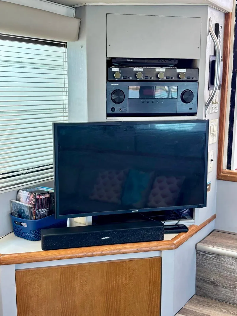 Slide: The Image of Entertainment setup inside 1991 Hatteras 52 Cockpit Motor Yacht with TV and audio system. - 17