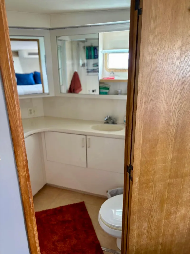 Slide: The Image of Bathroom interior of 1991 Hatteras 52 Cockpit Motor Yacht with sink and mirror. - 22