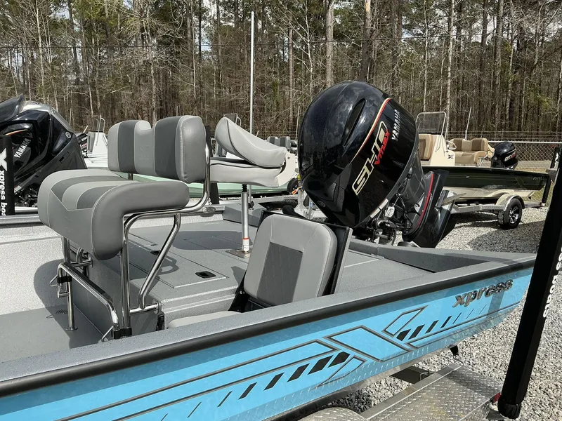 Slide: The Image of 2025 Xpress Hyper-Lift Series H22B boat with Yamaha engine, featuring gray seating. - 11