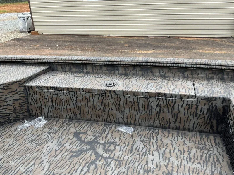 Slide: The Image of 2025 Xpress HD Series HD16DB boat interior with camouflage pattern. - 6