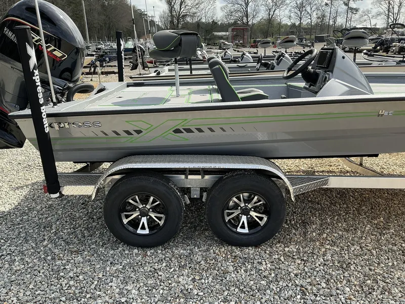 Slide: The Image of 2025 Xpress Hyper-Lift Bass Series boat on trailer, featuring sleek design and powerful engine. - 10