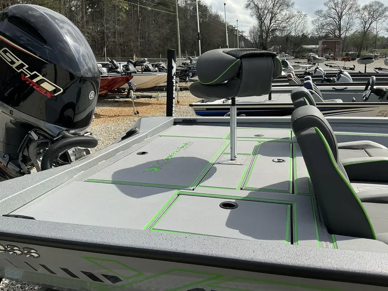 Slide: The Image of 2025 Xpress Hyper-Lift Bass Series boat with sleek seating and powerful engine. - 4