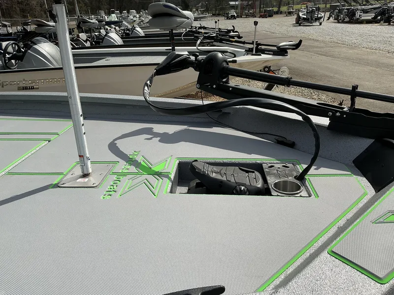 Slide: The Image of 2025 Xpress Hyper-Lift Bass Series boat deck with trolling motor and cup holder. - 7