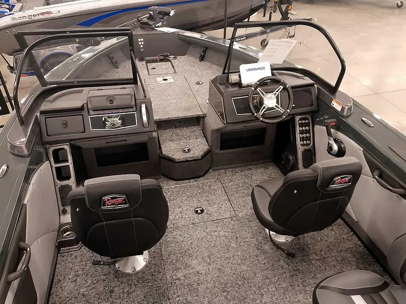 Slide: The Image of 2025 Ranger VX1988 WT boat interior with dual seats and modern dashboard. - 16