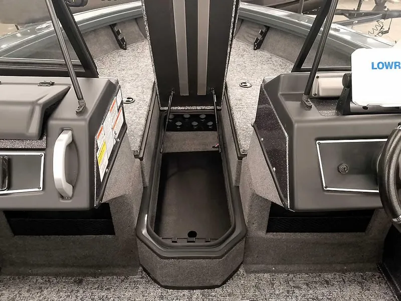 Slide: The Image of 2025 Ranger VX1988 WT boat interior with storage compartment and control panels. - 18