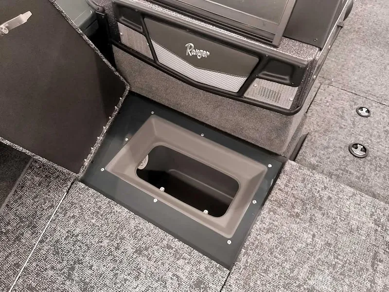 Slide: The Image of Ranger VX1988 WT 2025 boat interior with open storage compartment and carpeted flooring. - 19